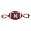 NCAA Nebraska Cornhuskers Football Squeaker Dog Toy with Nylon Rope and Woven Team Logo